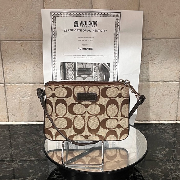 Coach Handbags - Coach Brown and Tan Wristlet